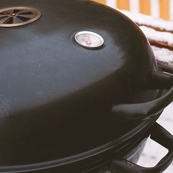 A grill smoker close up on the lid