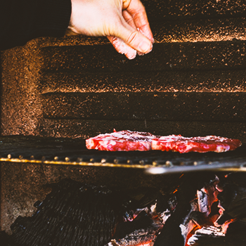 Cooking meat on charcoal