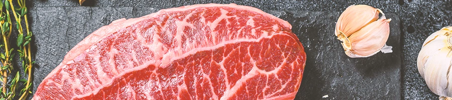 Close up of wagyu meat on a black table