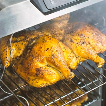 Cooked chicken inside an electric smoker