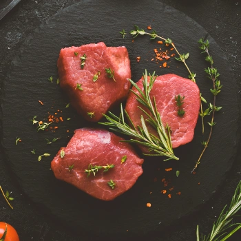 Raw tenderloin with herbs on the side