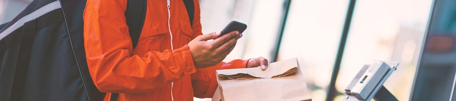 A delivery person on his phone