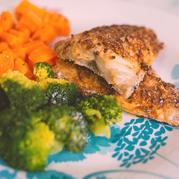 Cooked chicken with broccoli and carrots