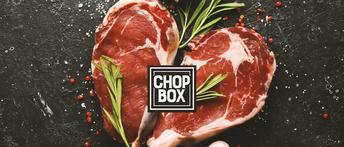 Close up of raw meat with the Chop Box logo