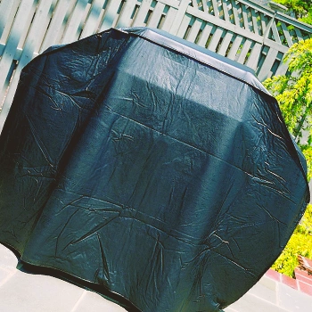 A grill cover covering a grill