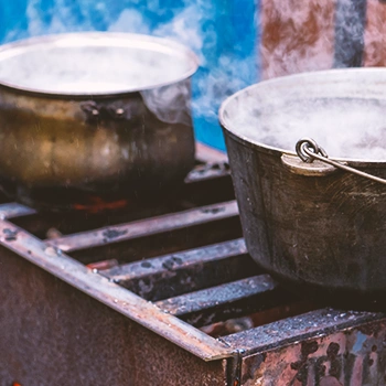 Pans of water being grilled