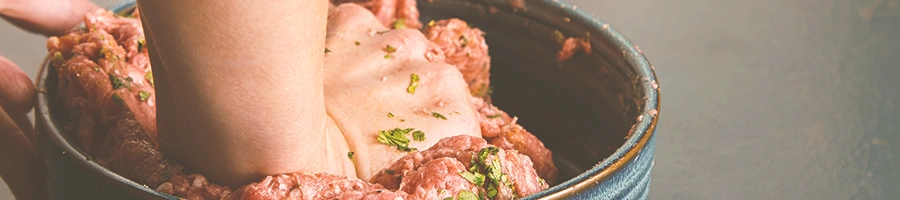 Ground beef being kneaded