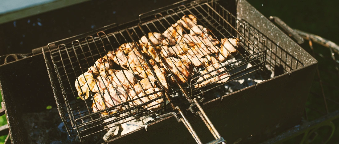 A bunch of chicken on a grill