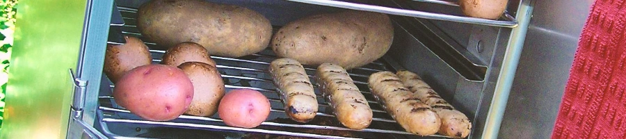 An electric smoker with a bunch of potatoes