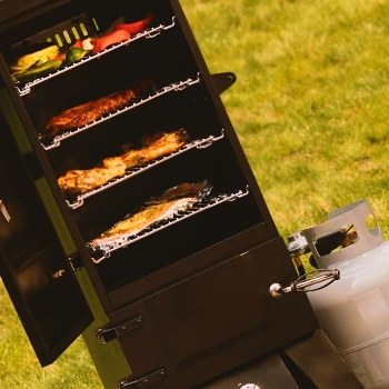 A propane gas smoker outside