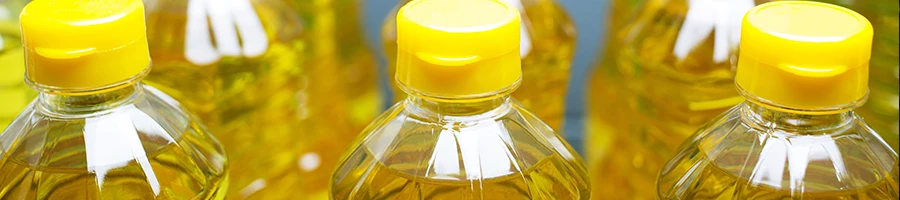 A collection of vegetable oil in plastic bottles