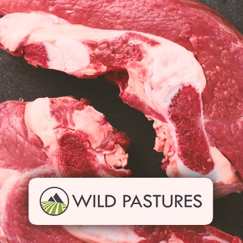 Close of shot of raw meat with the Wild Pastures logo