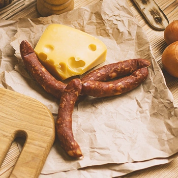 Raw sausage beside cheese