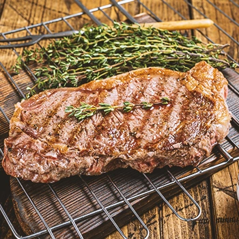 Cooked meat on a wooden board