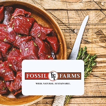 Elk meat with the Fossil Farms logo in front