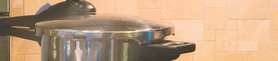Close up shot of a pressure cooker in a kitchen