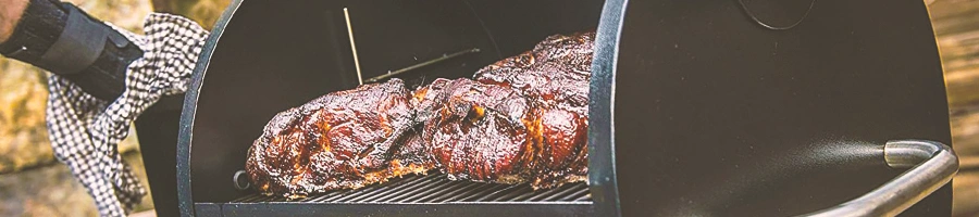 An open food smoker with meat inside