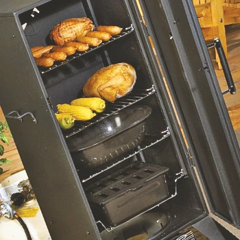 An electric smoker with food inside