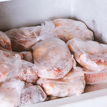 Raw chickens inside a freezer