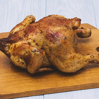 Roasted chicken on a wooden board