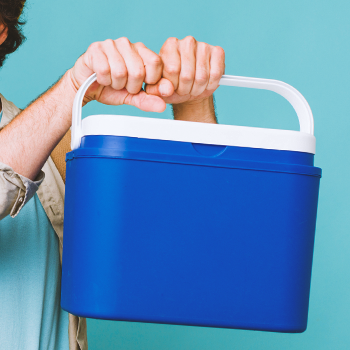 A person holding an ice box