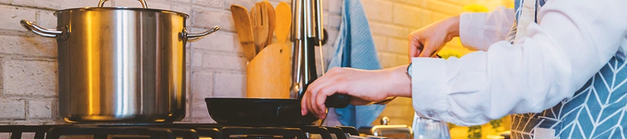 A person cooking something on a pan