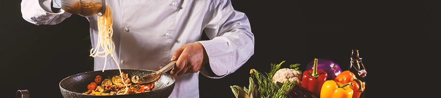 A chef cooking on a wok