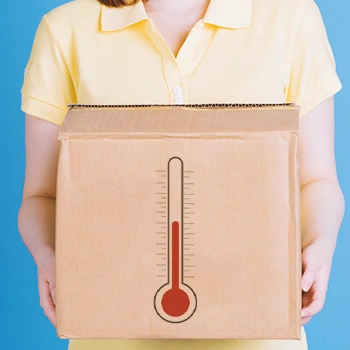 A person holding a box with a temperature graphic