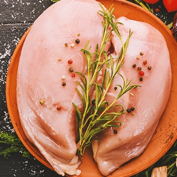 Turkey breasts on a wooden plate