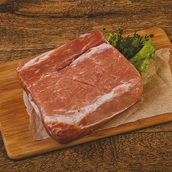 Raw meat on a wooden cutting board