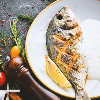 Grilled fish on a porcelain plate