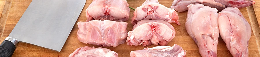 Chopped rabbit meat on a cutting board