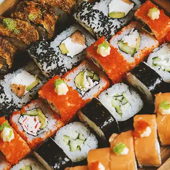 Close up shot of rows of sushi