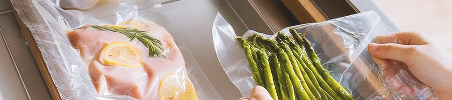 A person vacuum sealing food