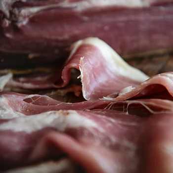 A close up image of a dry-cured ham