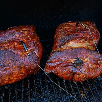 Meat inside a smoker with meat probe