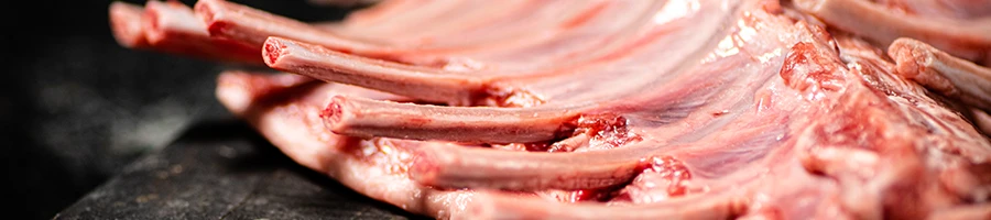 A close up image of raw rack lamb