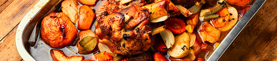 An image of baked meat dish with different fruits