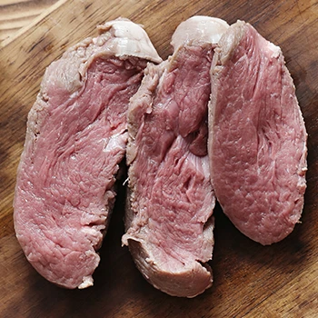 A dry beef slices on a cutting board