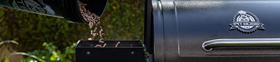 Pouring wood pellets into the pellet smoker