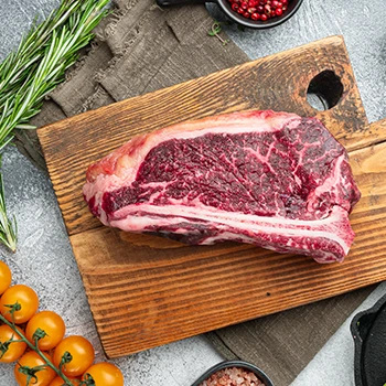 A large piece of bison meat on a cutting board