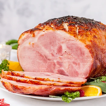 A close up image of a sliced ham