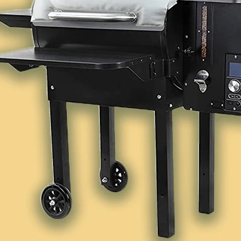 A close up image of a smoker grill with wheels