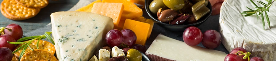 Close up image of different cheese used in charcuterie board