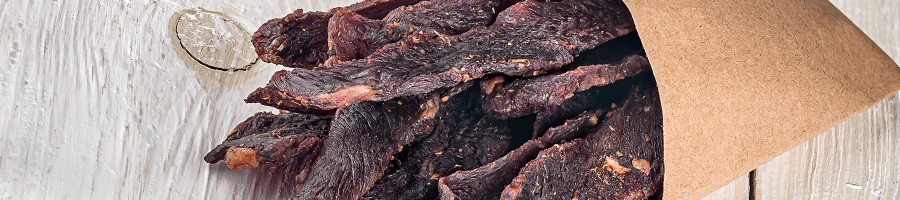 An image of beef jerky on a paper bag