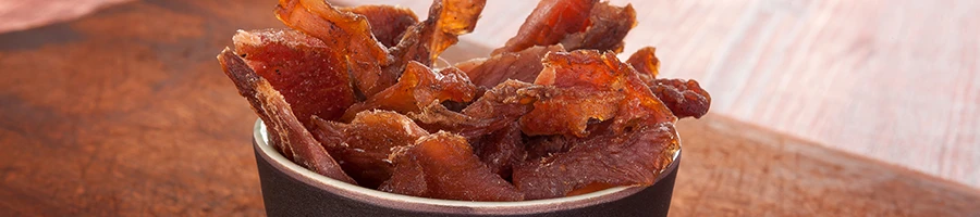 An image of beef jerky on a small bowl