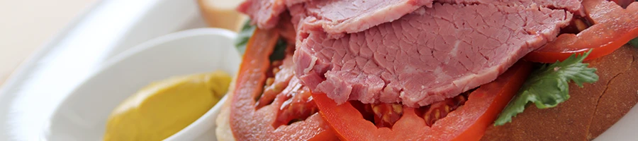 A close up image of corned beef sandwich