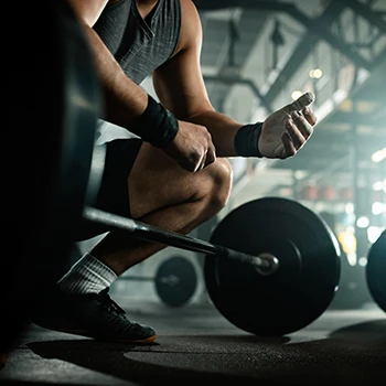 A person getting ready to lift weights