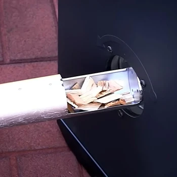 An image of wood pellet being inserted in a smoker