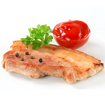 An image of fried pork with tomato and garnish